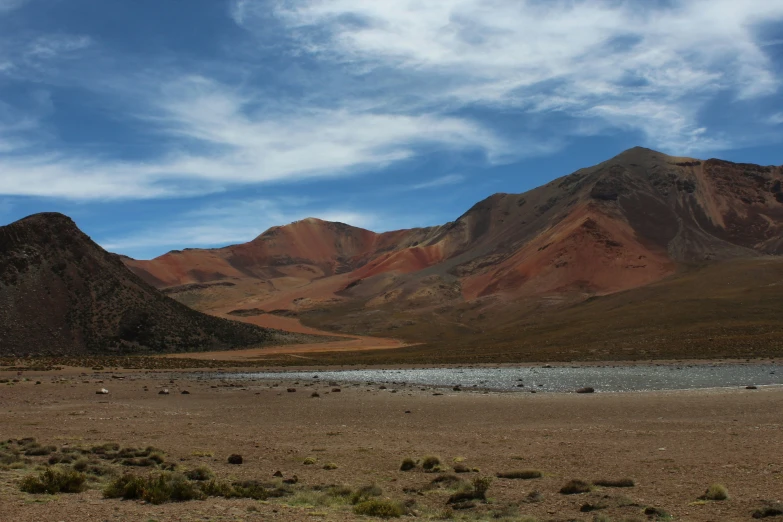 some hills are shown and there is still water