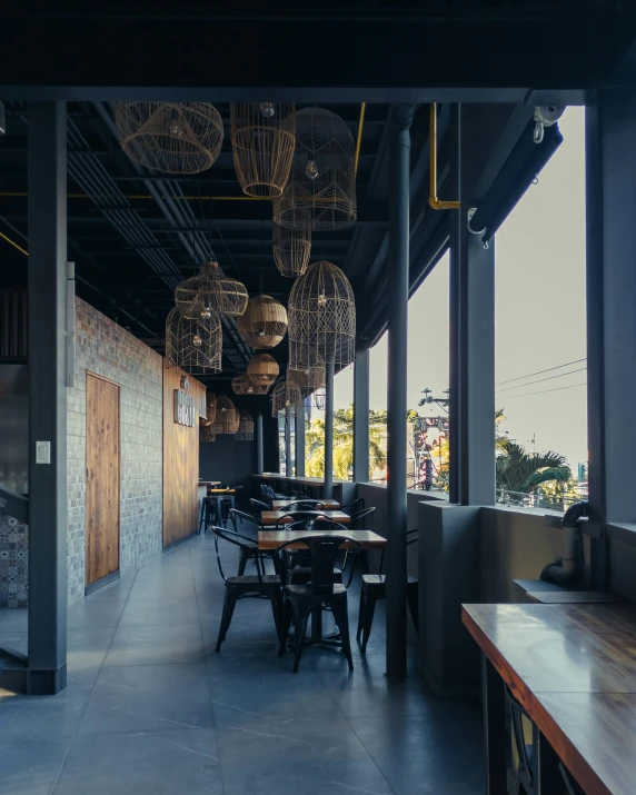 a restaurant area with seating and light fixtures