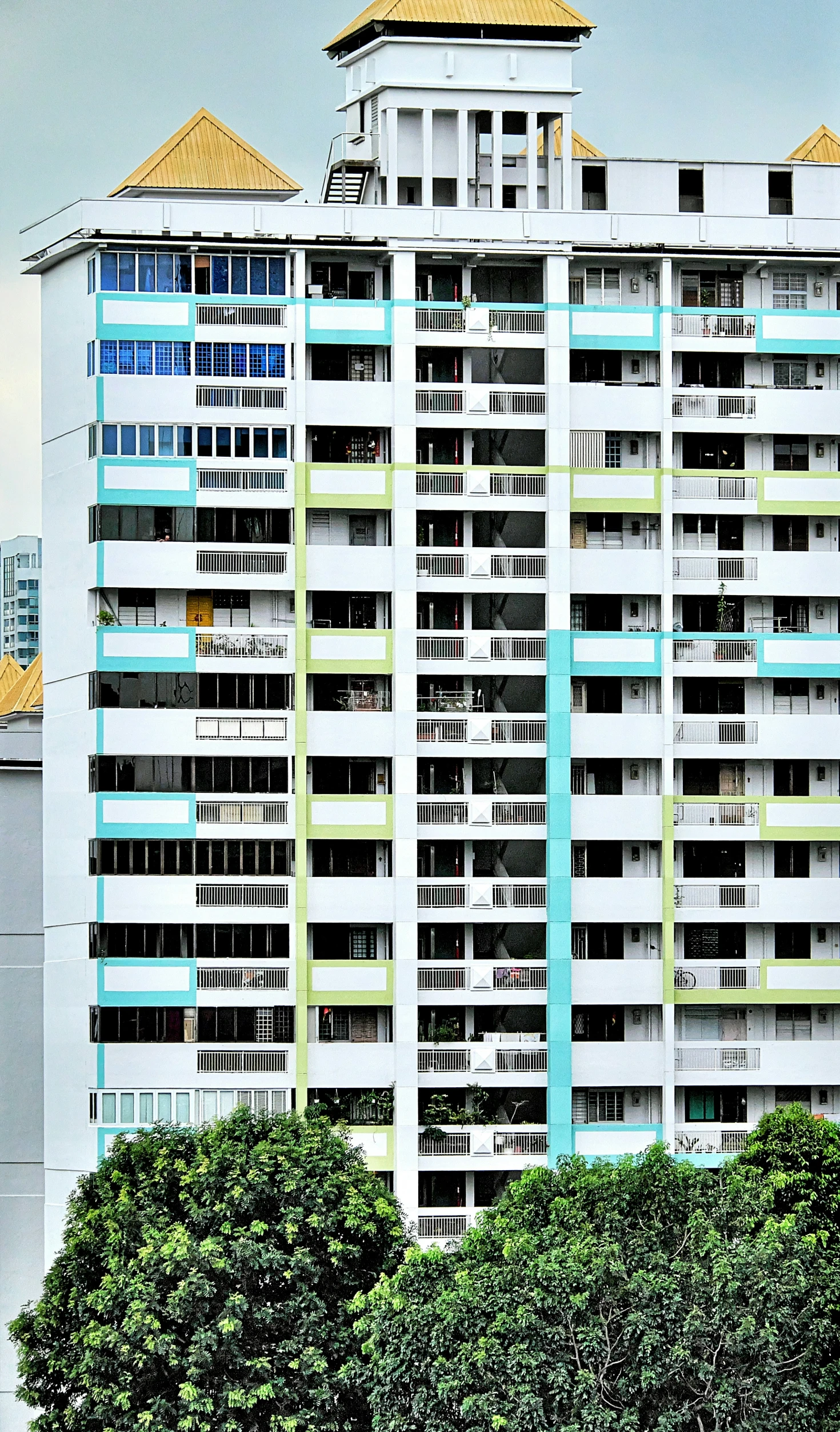 large multi - story building with trees by it's sides