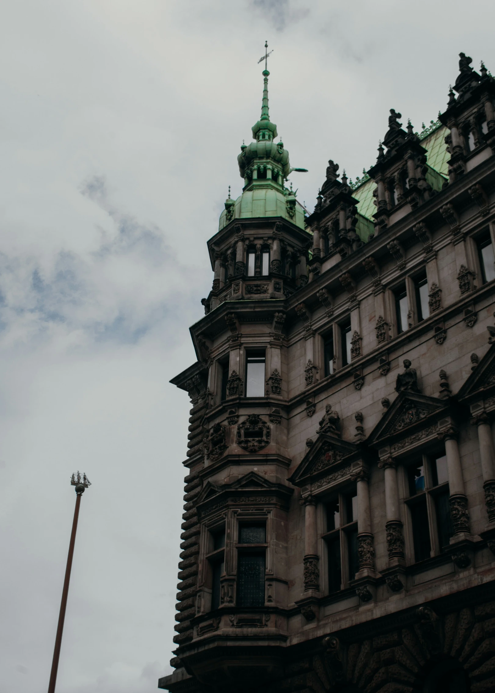 the tall building with a clock on it's steeple