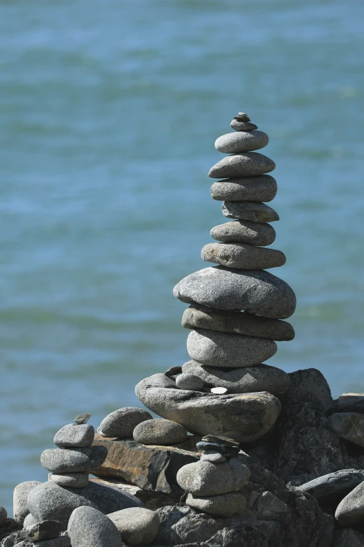 a pile of rocks next to water