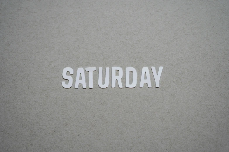 the word saturday placed in some type of paper