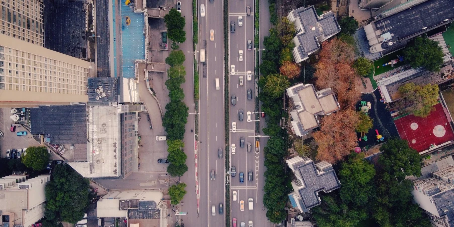 an overhead view of an urban street and traffic