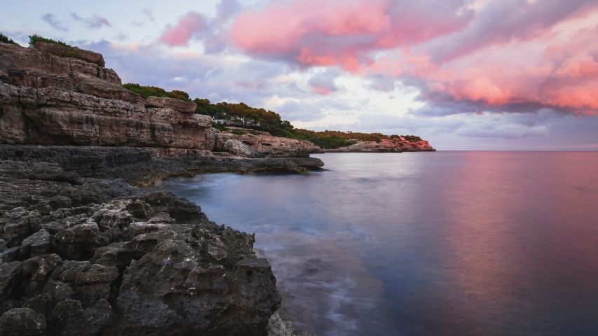 a large body of water surrounded by rocks