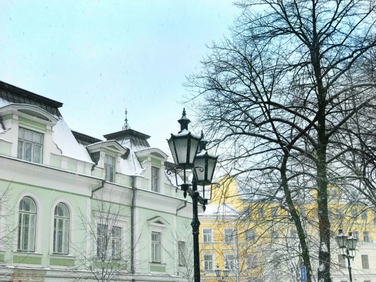 an old street light next to a building