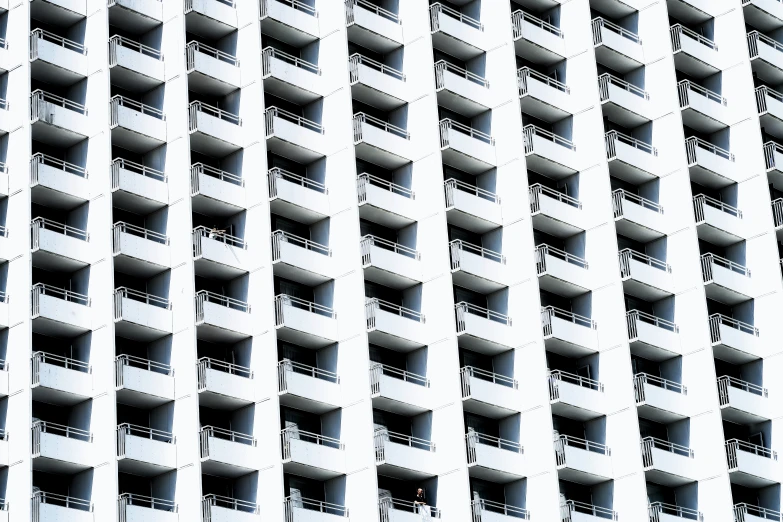 the facade of an apartment building against the sky