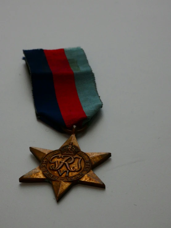 a colorful, ribbon and award hang from a star