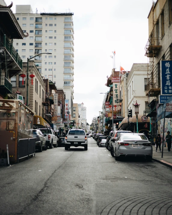 cars parked on the side of a city street