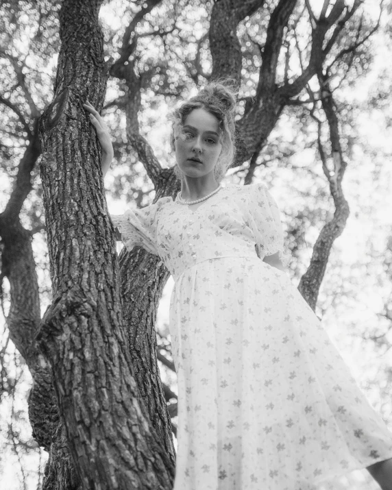 a woman posing in the woods for a picture