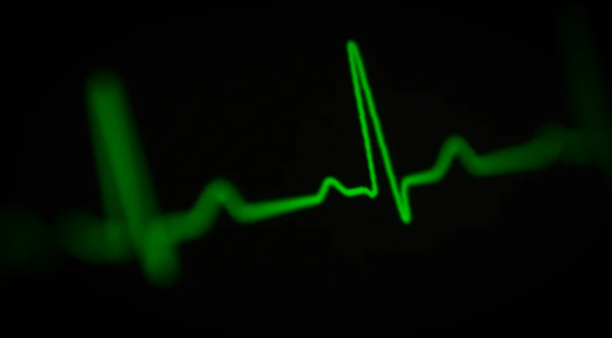 a line of green heartbeat on black background