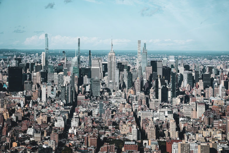 a large group of tall buildings with some water in front of them