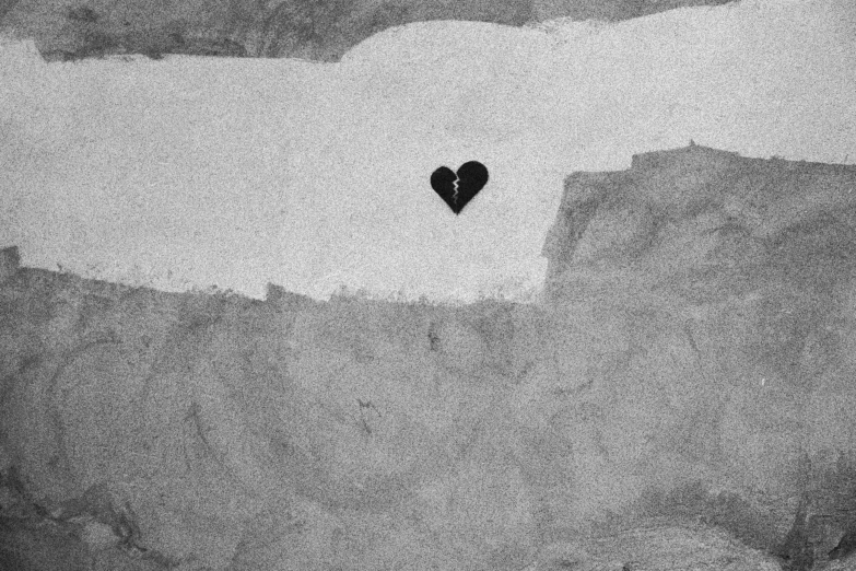 black and white pograph of a heart on a wall