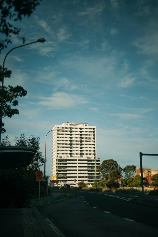 the view from the street of a building on the horizon