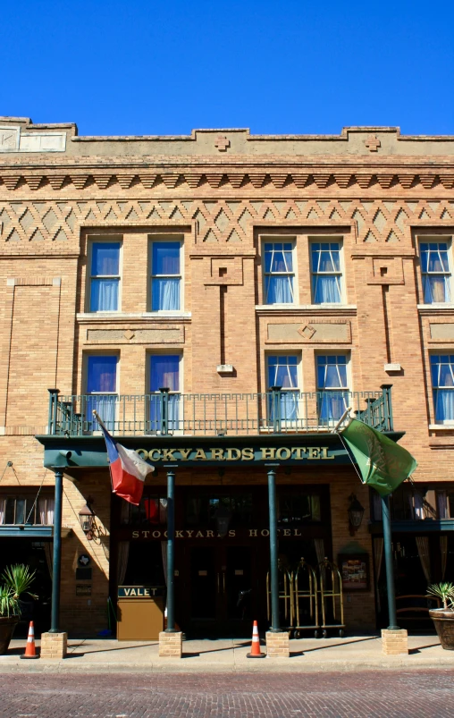 a street corner shows a tall brick building