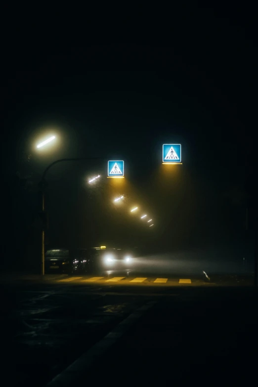 fog and lightening over an intersection at night