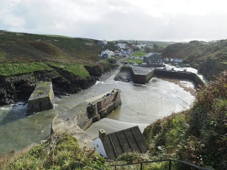 the road and the beach are connected to several concrete barriers