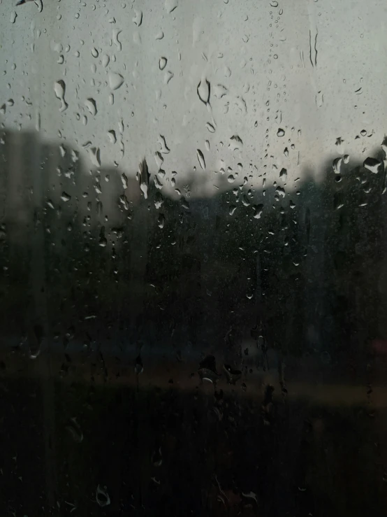 the rain is shining on the window outside