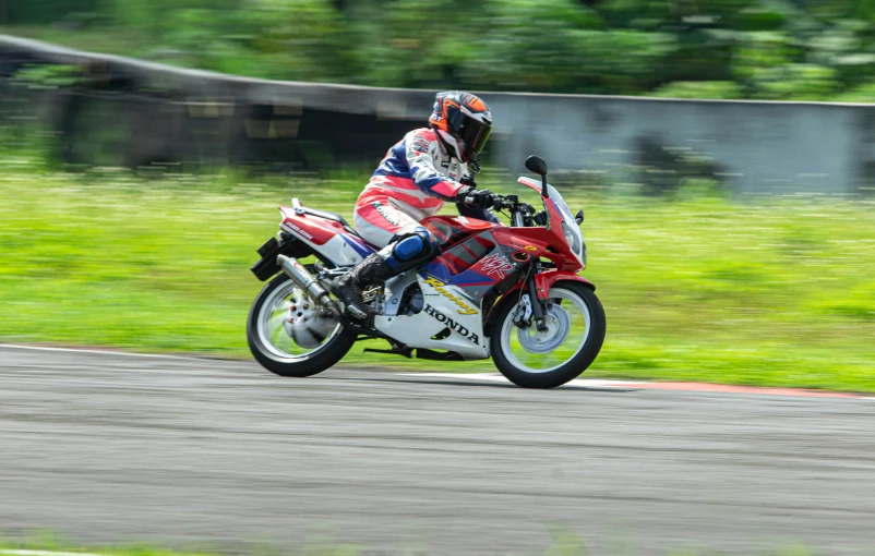 a person riding a motorcycle on a race track