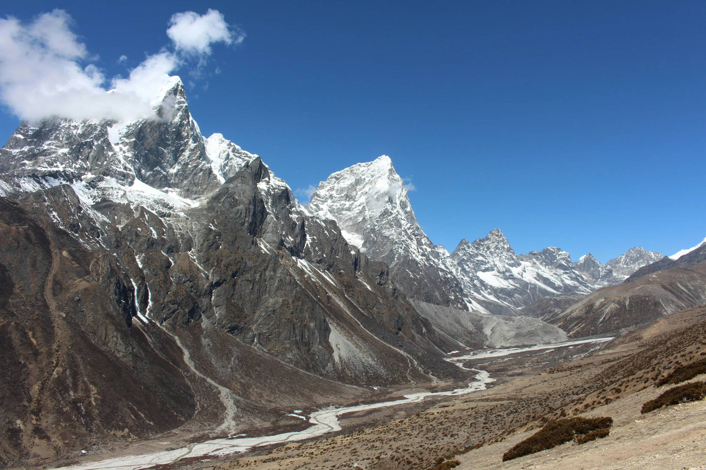 the mountains are covered with snow and ice