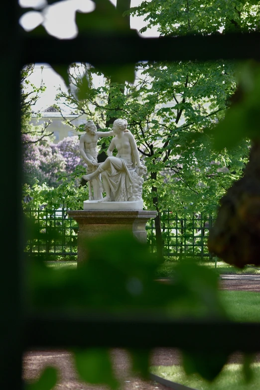 there is an image of a statue in the park