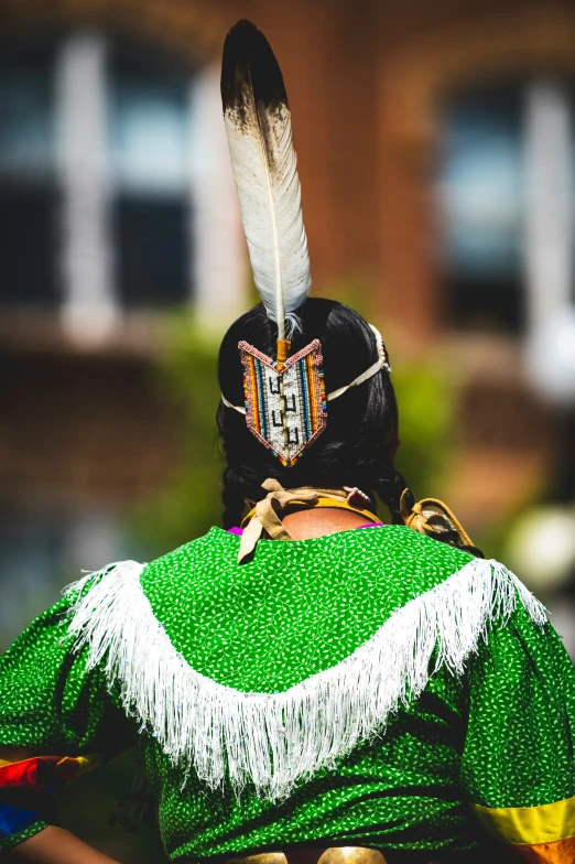 a native american costume is looking at the other outfit