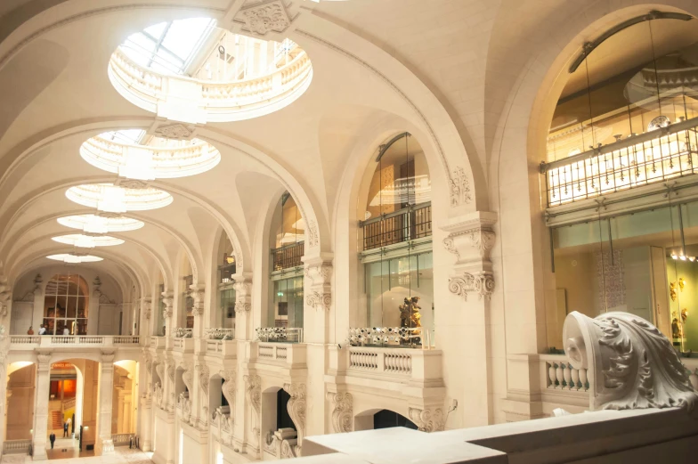 a large open building with columns and arches