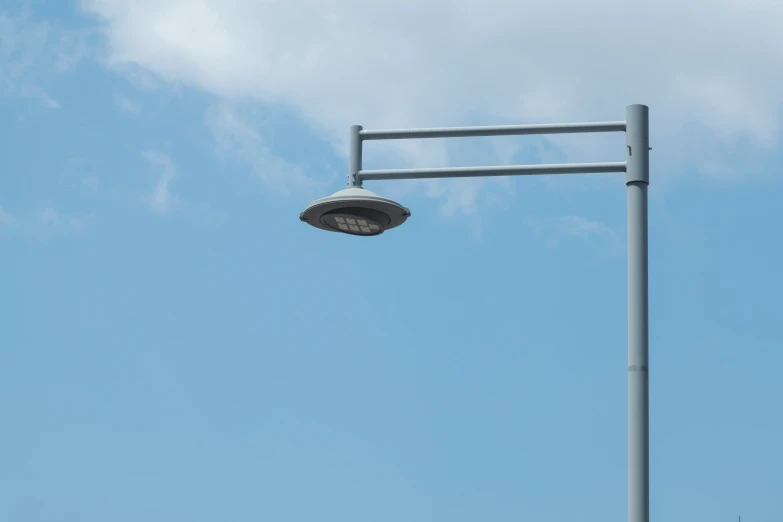 a street light is shown near the sky