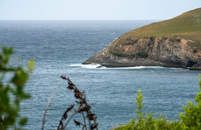 a lone boat sits out on the ocean