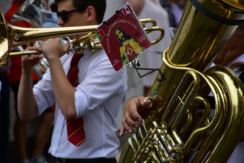 a group of people with big gold instruments