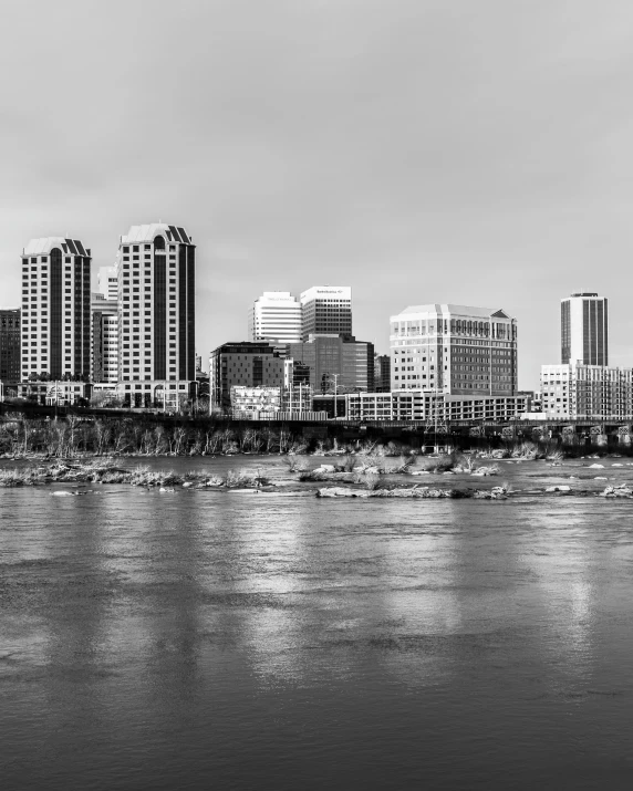 a river with buildings in the background