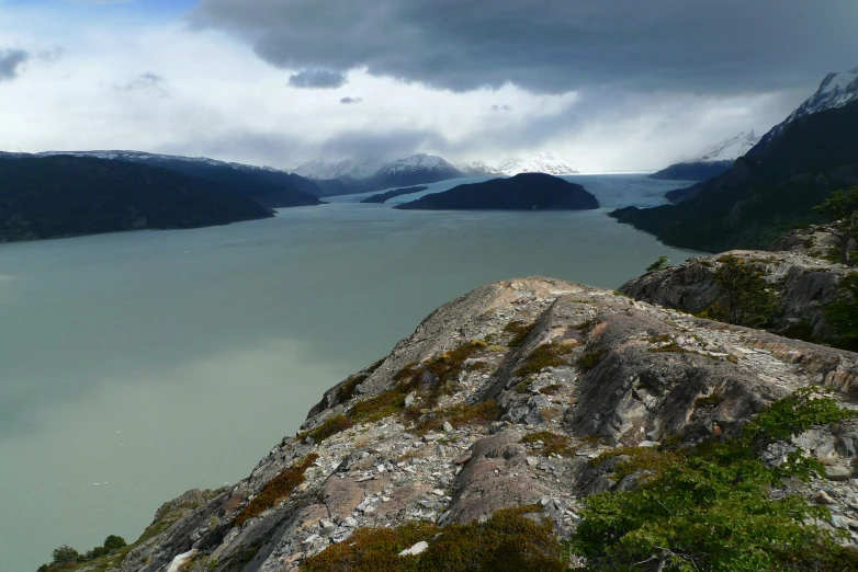 a view of mountains and a body of water on the far side