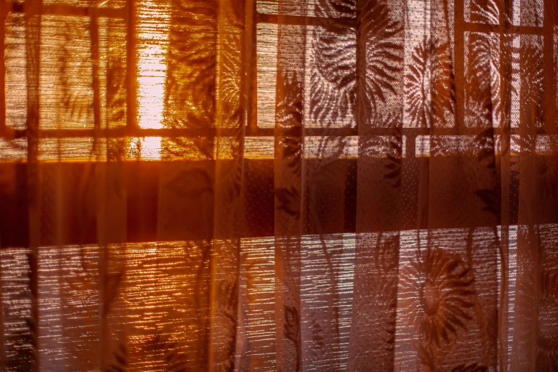 the texture of the curtain is gold in color