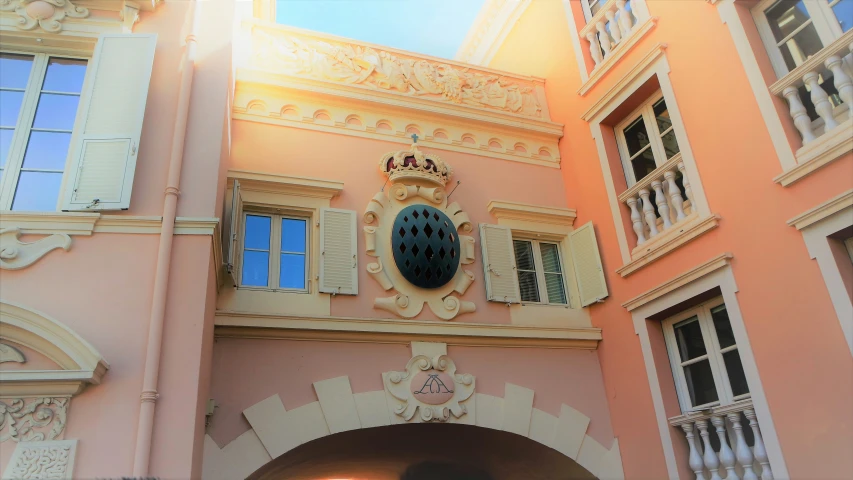 the corner of a building with many windows and doors