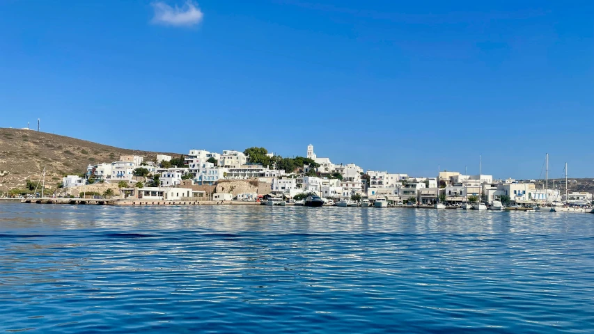 boats float along a beautiful sea on a sunny day