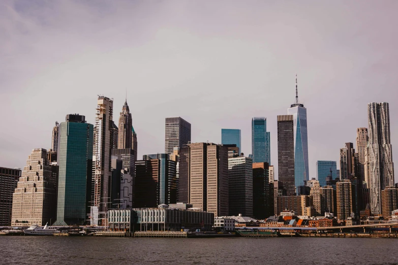 large buildings surrounding a body of water next to each other