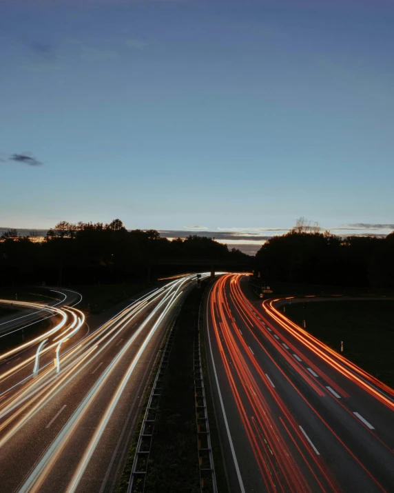 a freeway filled with lots of traffic near trees