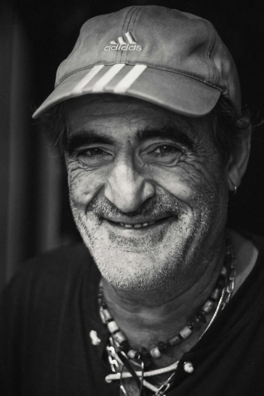 black and white pograph of a man wearing hat