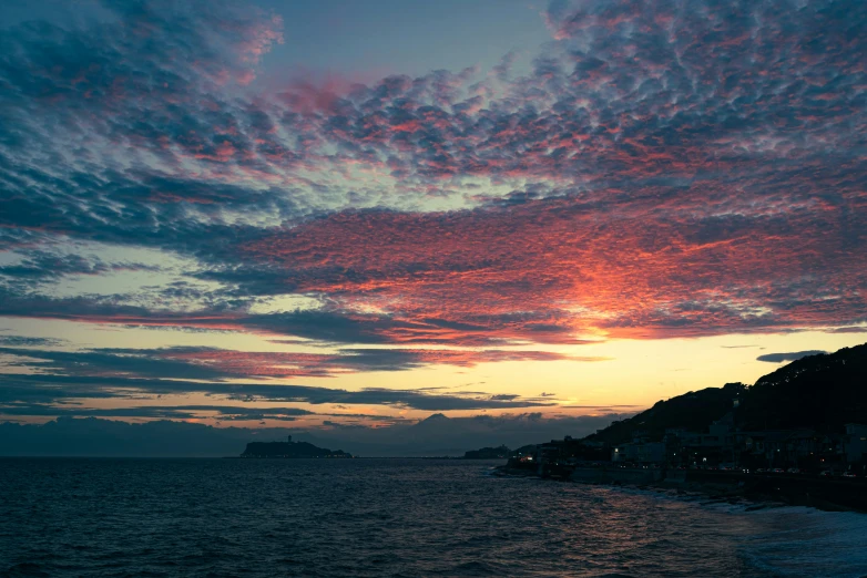 beautiful sunset in front of the sea with clouds