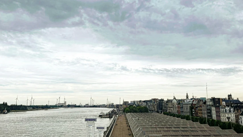 a river in a city next to tall buildings