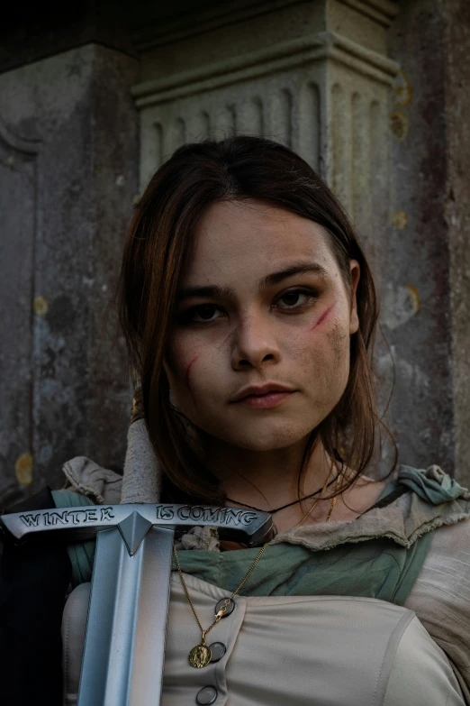 a girl wearing white is posing for the camera