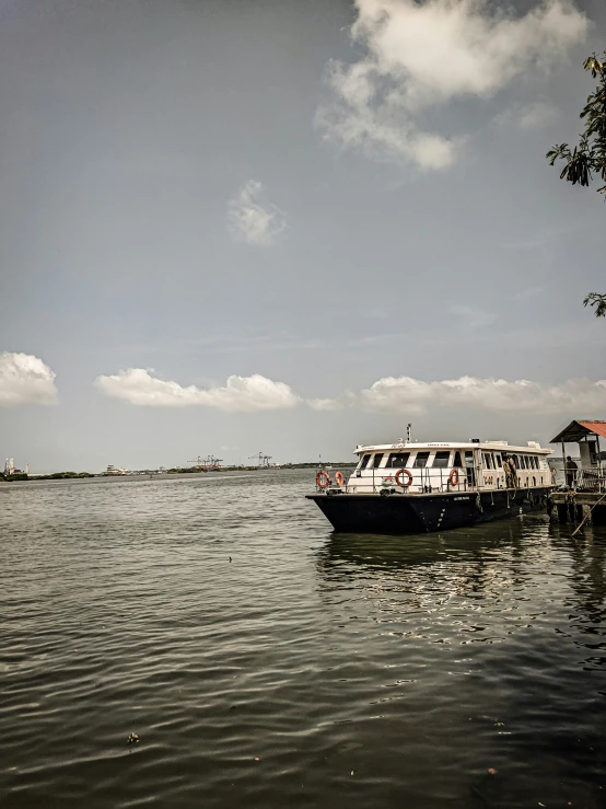 the small boat is carrying passengers for some riding