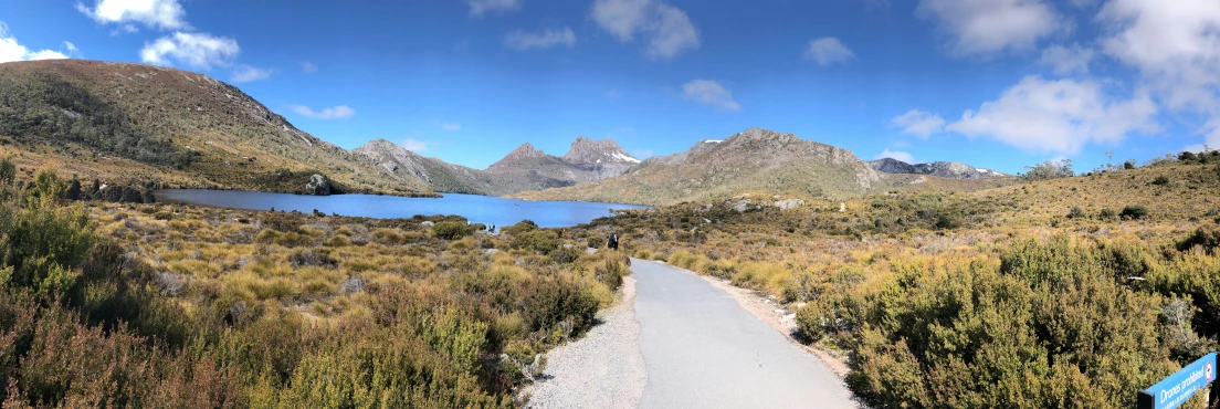 the blue ribbon is marking the path between the two mountains