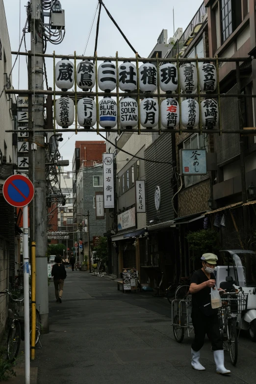 a person standing in the middle of an alley