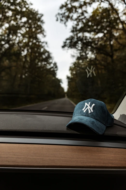 an image of a baseball cap on top of the roof of a car