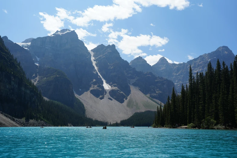 the mountains are rising above a body of water