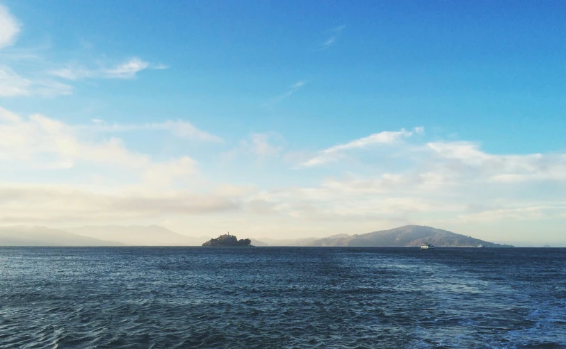 an island sits in the middle of a body of water