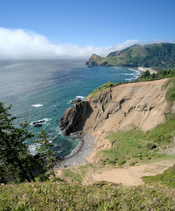 a beach and hills near the ocean