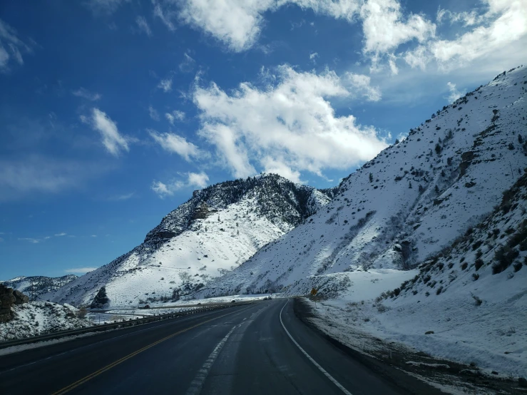 a long street runs through a mountain valley