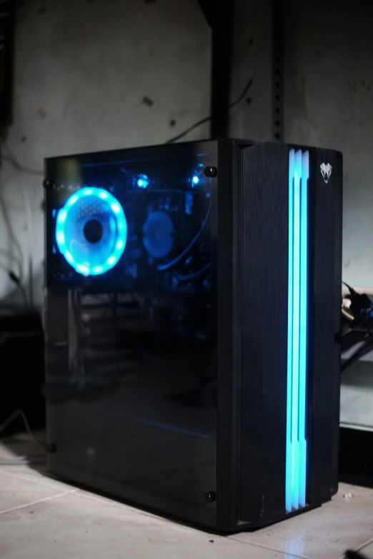 a computer tower with a light blue backlit