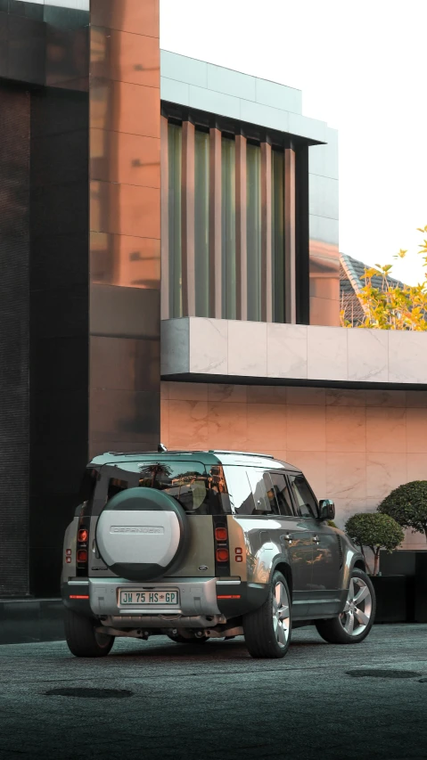 a silver suv parked near a building